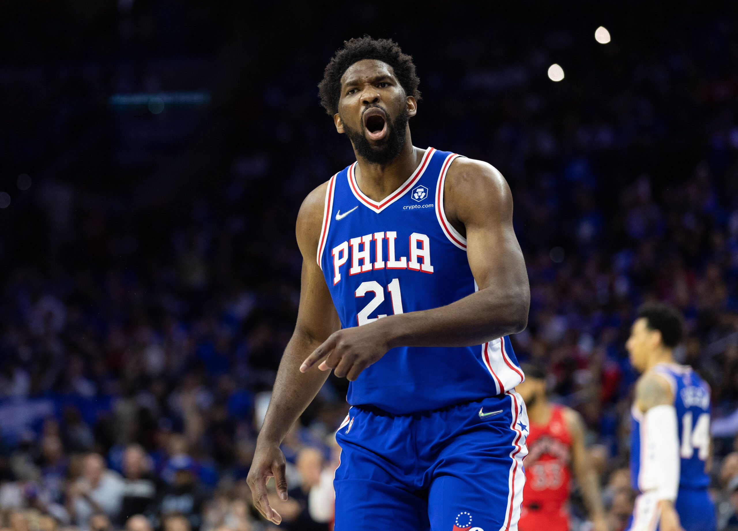 Joel Embiid celebrates after scoring a basket against the Nuggets