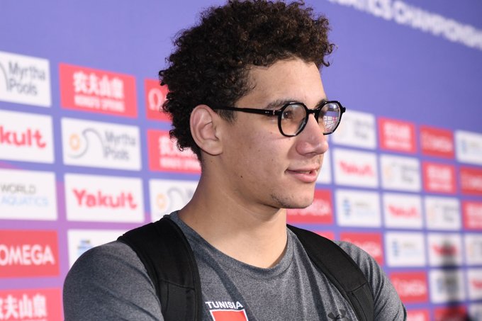 Ahmed Hafnaoui swimming in a pool