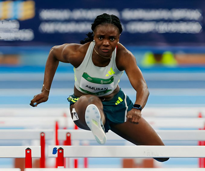 Tobi Amusan celebrates victory in 60m hurdles