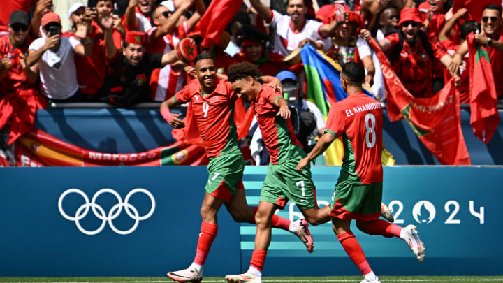 Les joueurs du Maroc célèbrent leur victoire contre l'Iran